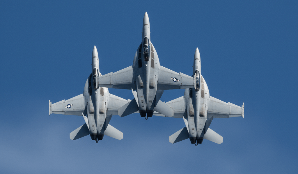 U.S. Navy F/A-18 Hornet fighter jets flying in tight formation