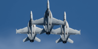 U.S. Navy F/A-18 Hornet fighter jets flying in tight formation