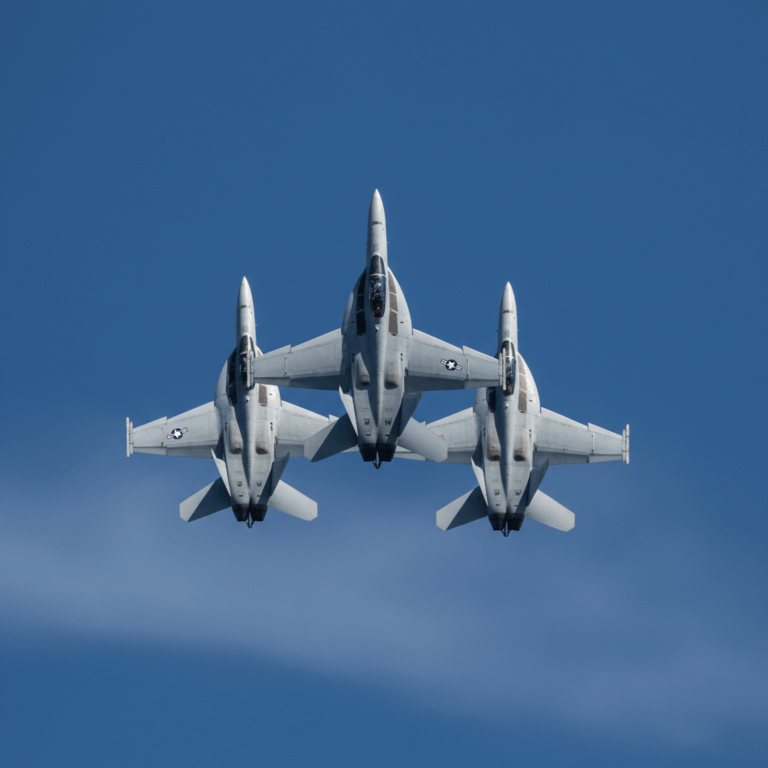 U.S. Navy F/A-18 Hornet fighter jets flying in tight formation